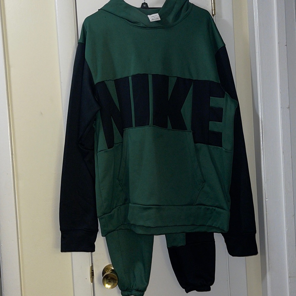 Green and black NIKE sweater and pants.